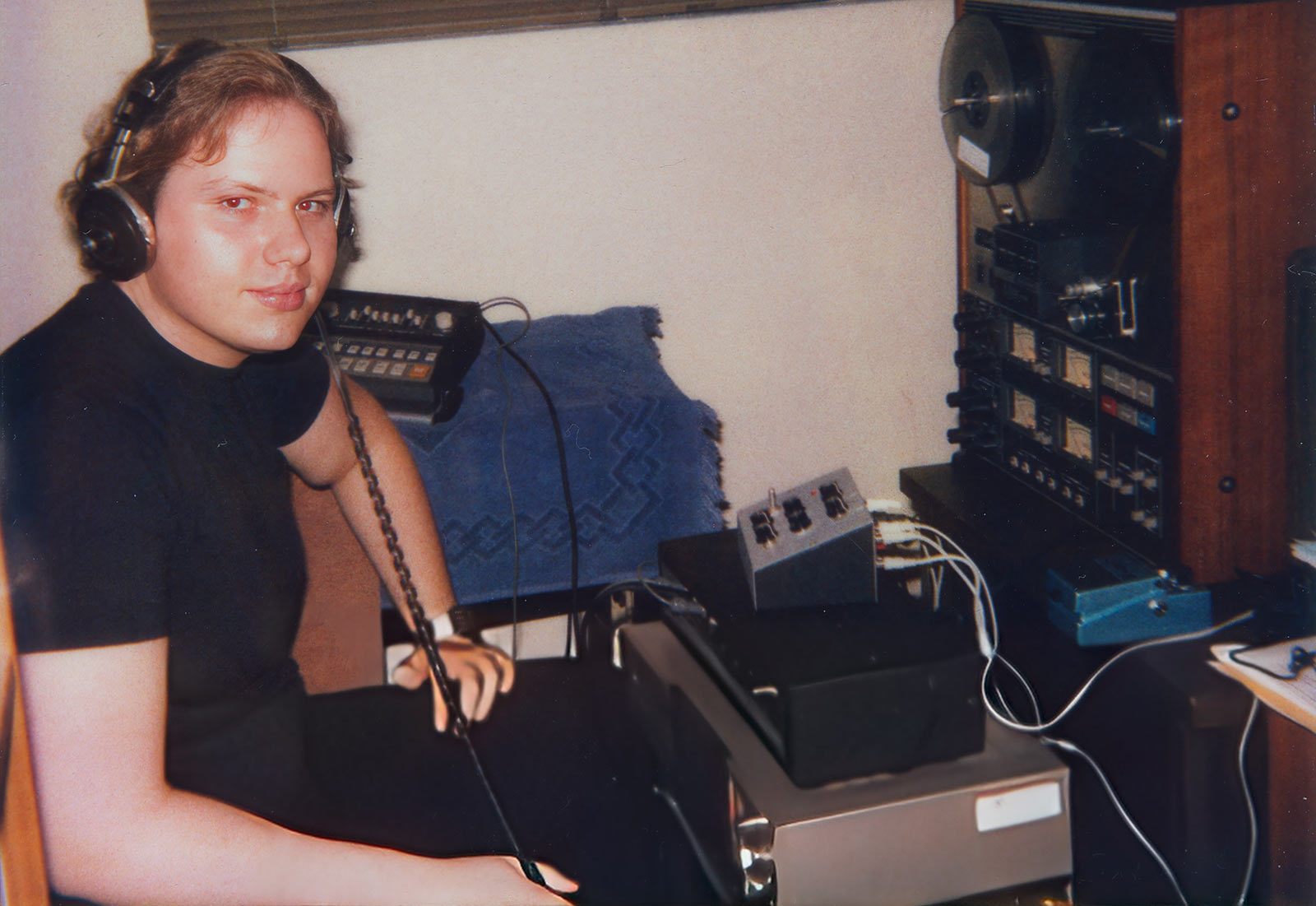 Christopher Simmons, aka BLUETOY, mixing music on Teac A3340S, circa 1983